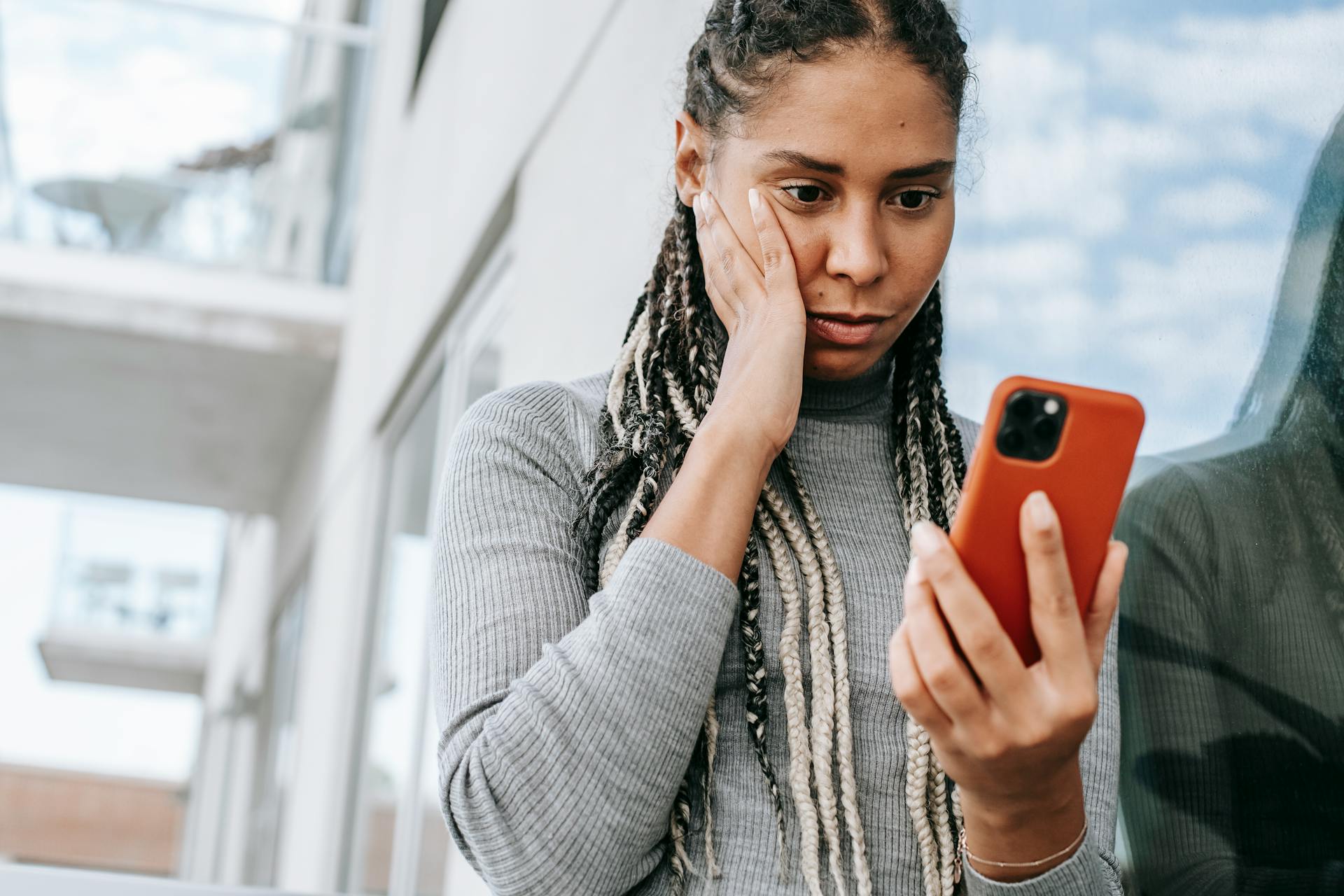 Woman-reading-text-from-date-on-phone